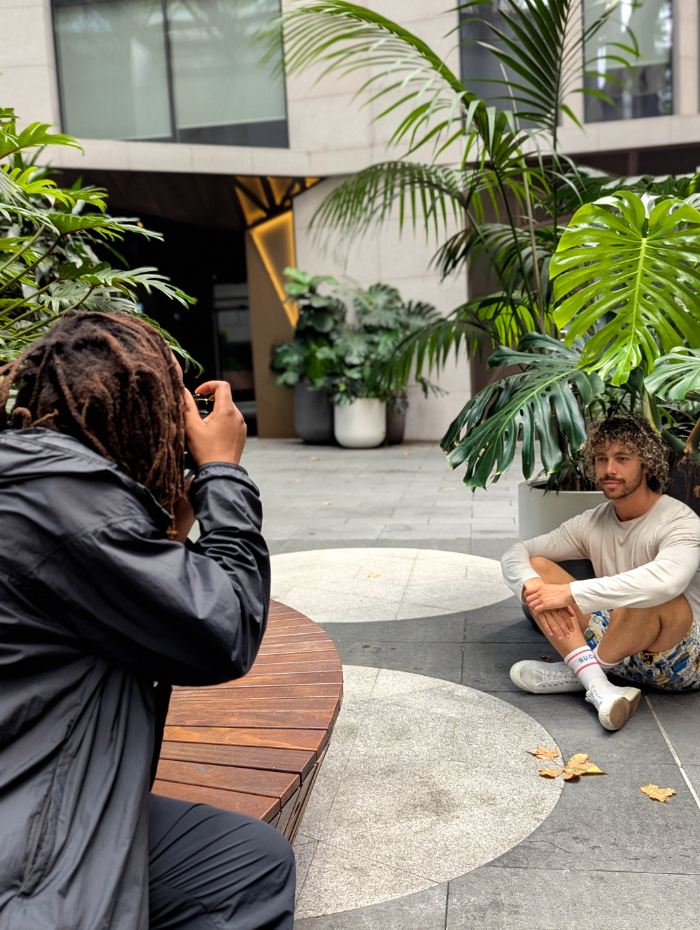 Marcus sitting under a leaf